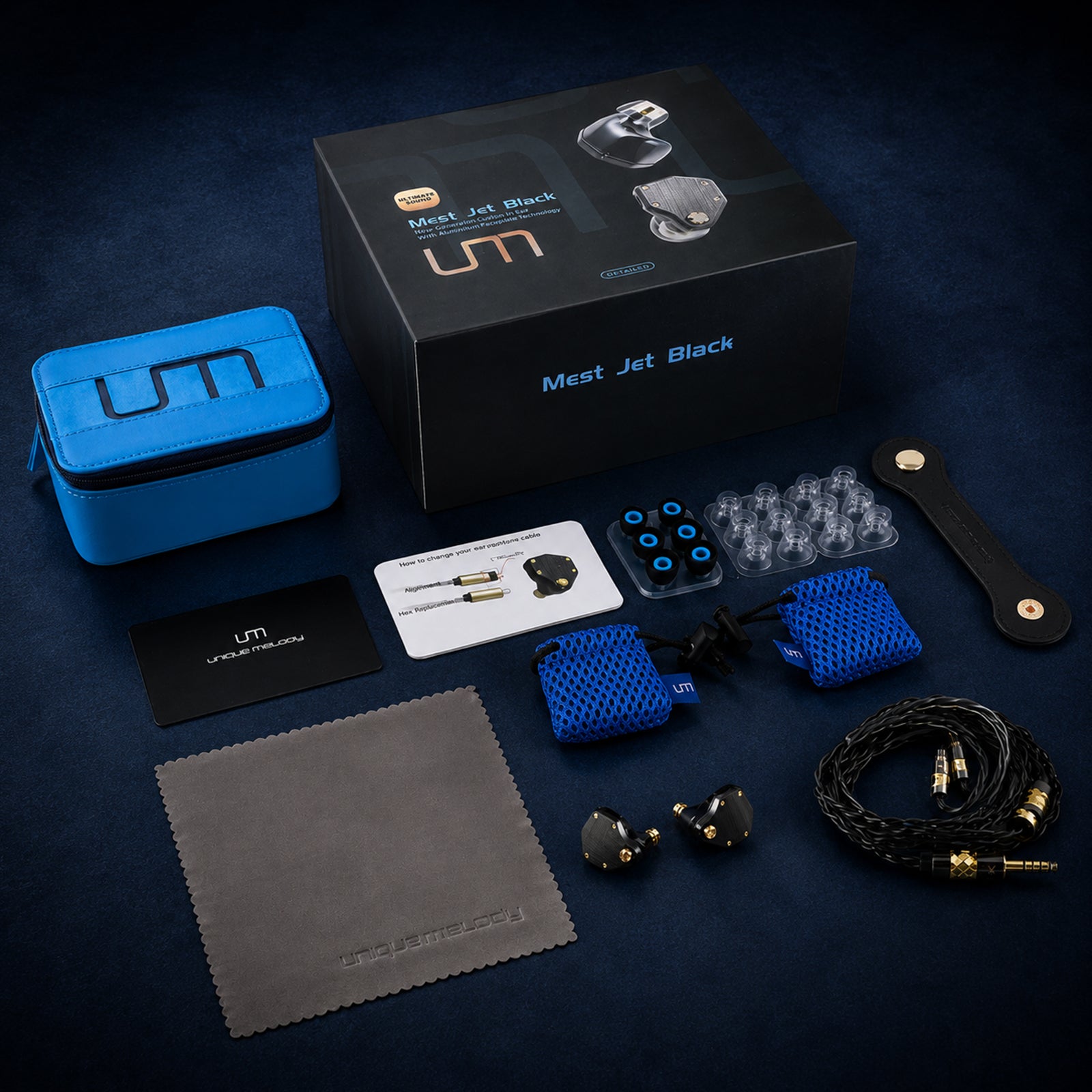 UM Mest Jet Black packaging with accessories and carrying case