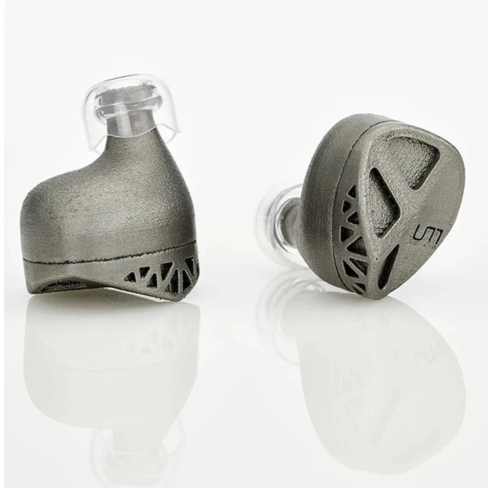 Close-up of metallic in-ear monitors with transparent tips on white background