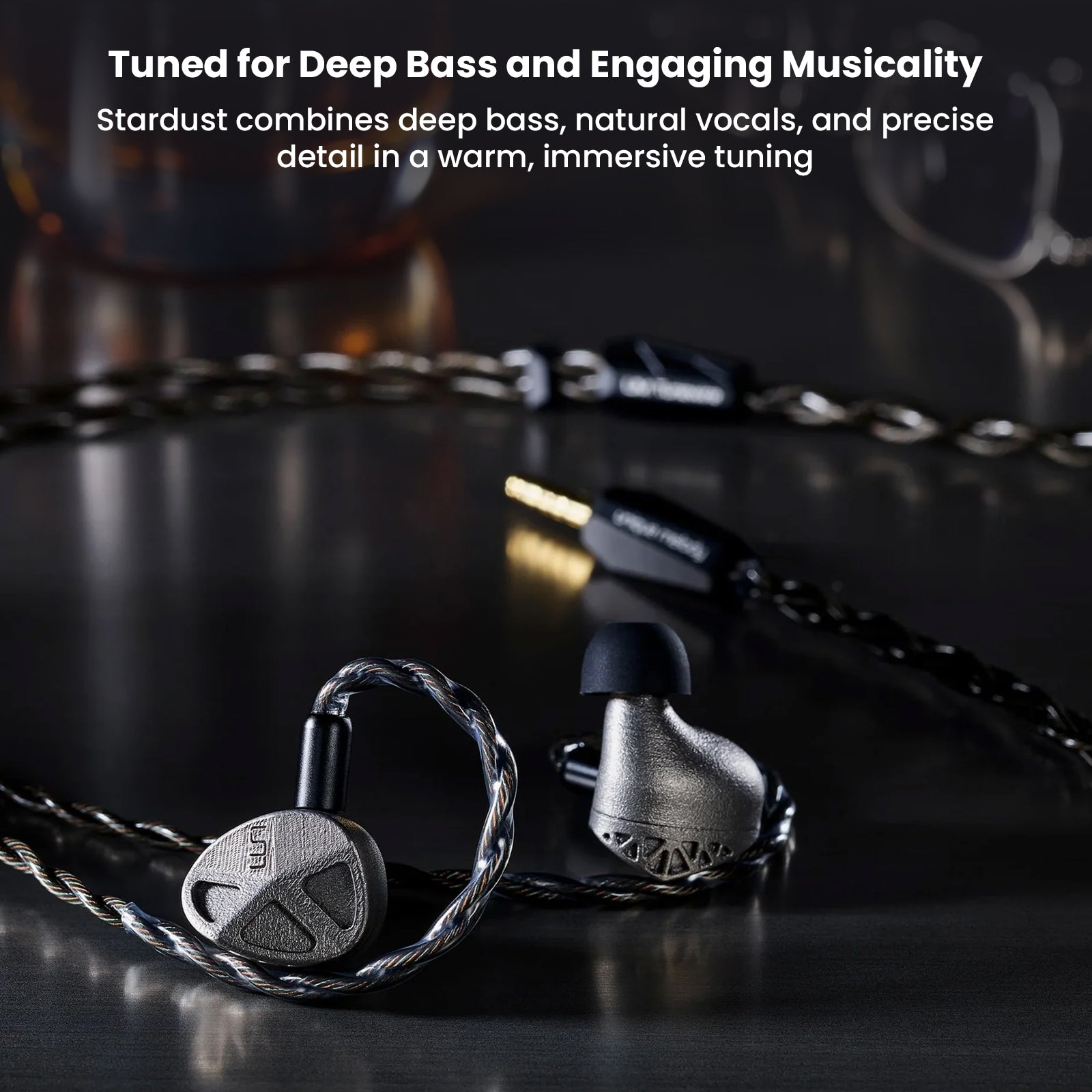 High-tech titanium in-ear monitors with detailed component diagram on black background