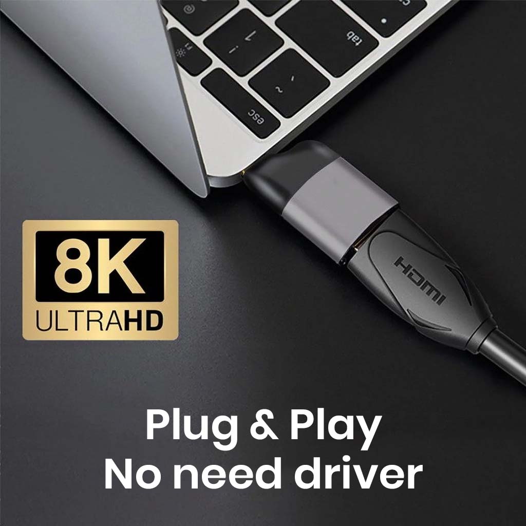 TECPHILE HDMI 2.1 to USB4 adapter plugged into laptop, supports 8K Ultra HD with plug-and-play functionality, no driver needed.