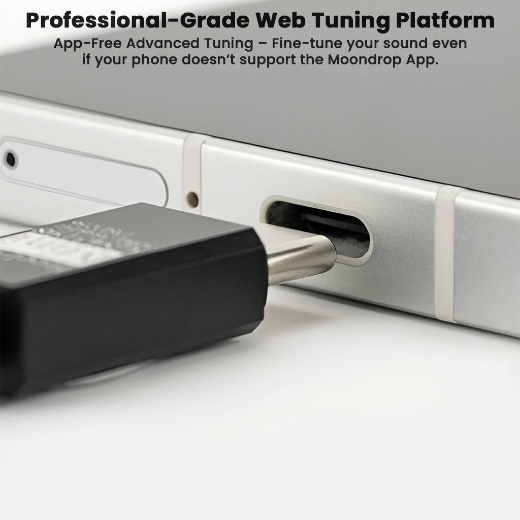 Moondrop FreeDSP Mini DAC plugged into USB-C port, emphasizing professional-grade web tuning platform for advanced audio customization.