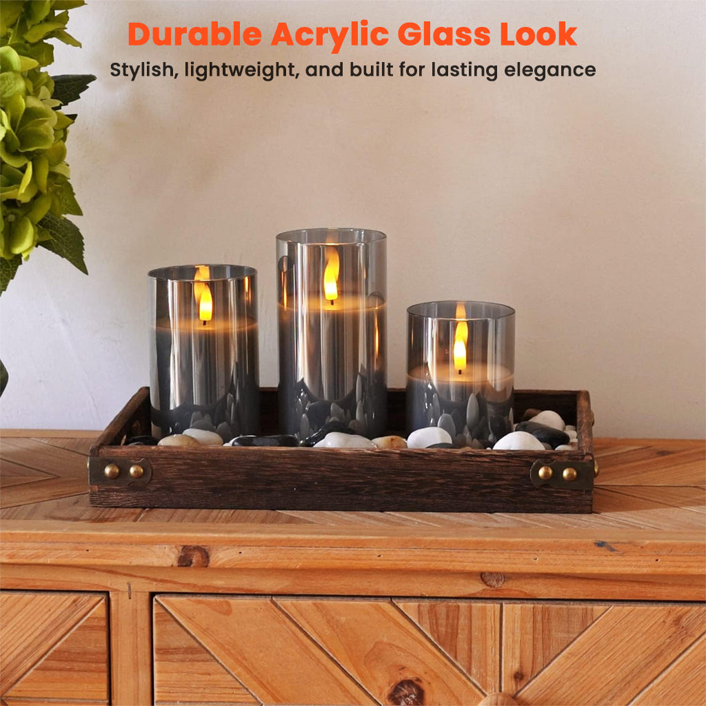 TECPHILE Flameless LED Smart Candle Lights Pack of 3 displayed on a wooden tray with stones, showcasing durable acrylic glass design.