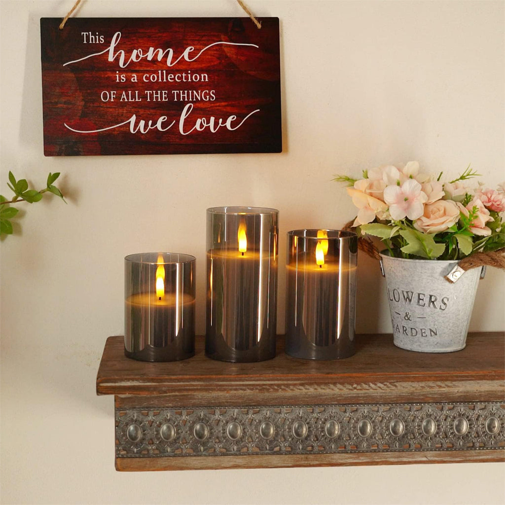 TECPHILE Flameless LED Smart Candle Lights Pack of 3 on a rustic shelf, adding warmth and charm to home interiors with safe LED glow.