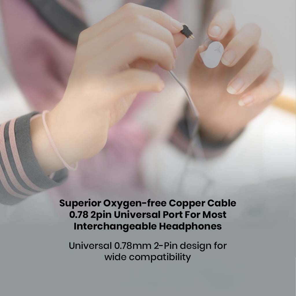 Hands connecting MOONDROP Chu 2 DSP cable to IEMs, highlighting 0.78mm 2-pin universal port and oxygen-free copper build.