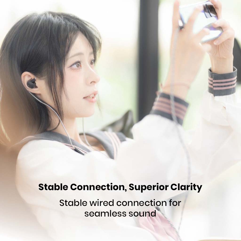 User wearing MOONDROP Chu 2 DSP cable with IEMs while gaming, showcasing stable USB-C connection and superior sound clarity.