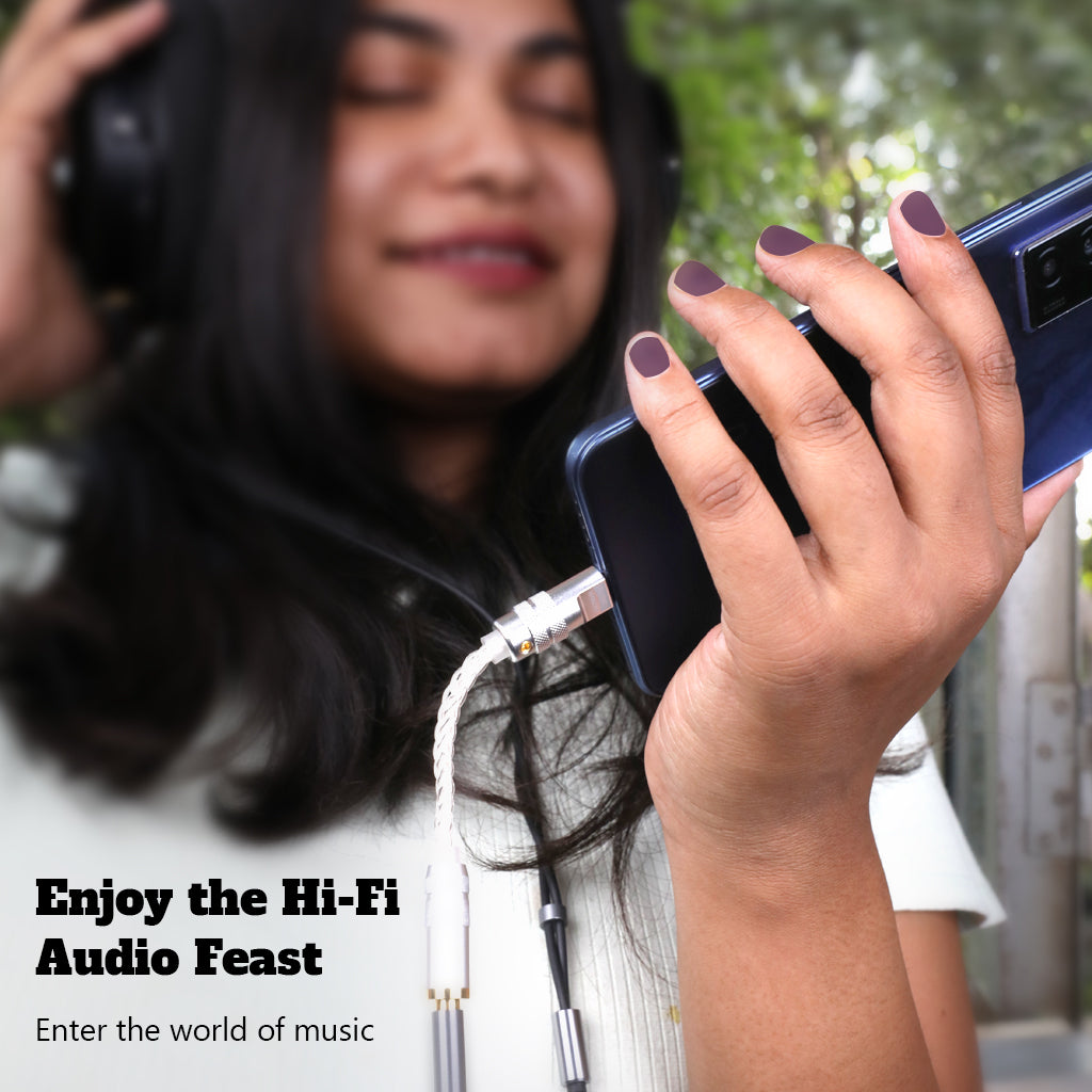 User enjoying music with AUDIOCULAR DAC Dongle, experiencing Hi-Fi audio through USB-C to 4.4mm headphone adapter.