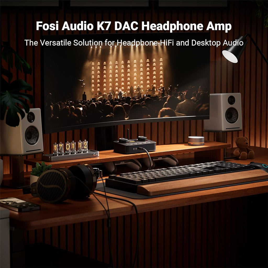 Fosi Audio K7 DAC Amp setup on a desktop with speakers and headphones, ideal for audiophile-grade headphone HiFi and immersive desktop audio.