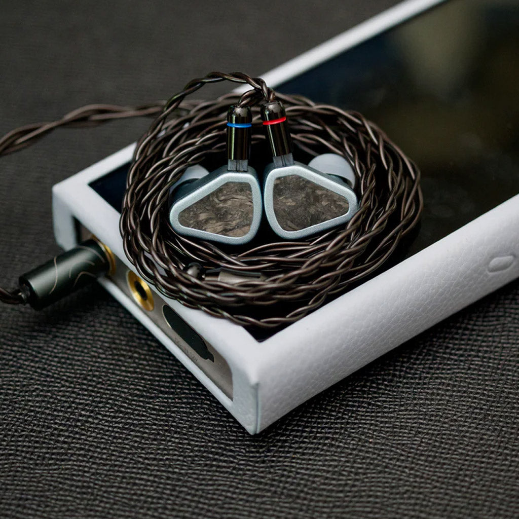 SYMPHONIUM Audio- Giant IEM (Launch Edition) connected to a portable music player, emphasizing its audiophile-grade performance on the go.