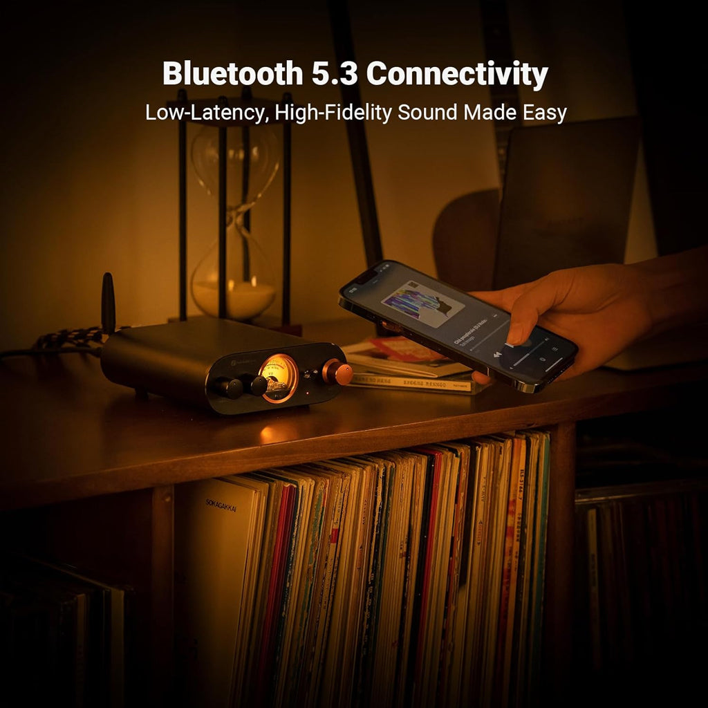 Fosi Audio MC101 Bluetooth Stereo Amplifier in use with a smartphone, showcasing Bluetooth 5.3 connectivity for low-latency audio streaming.
