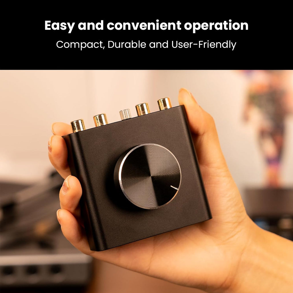 Compact NEOHIPO TP10 Phono Preamp held in hand, showcasing user-friendly design and portable audio solution.