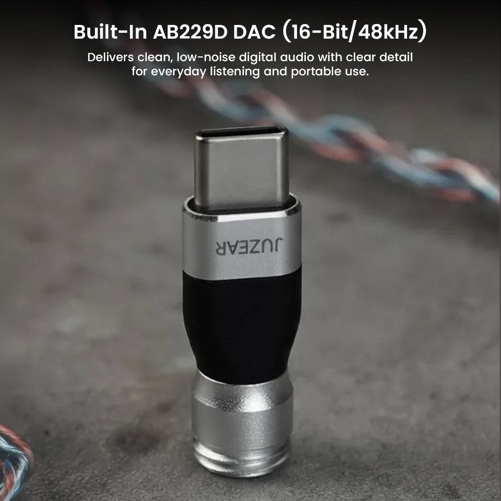 JUZEAR Defiant TYPE-C DAC Adapter with built-in AB229D DAC, delivering 16-bit/48kHz clean, low-noise digital audio for portable use.