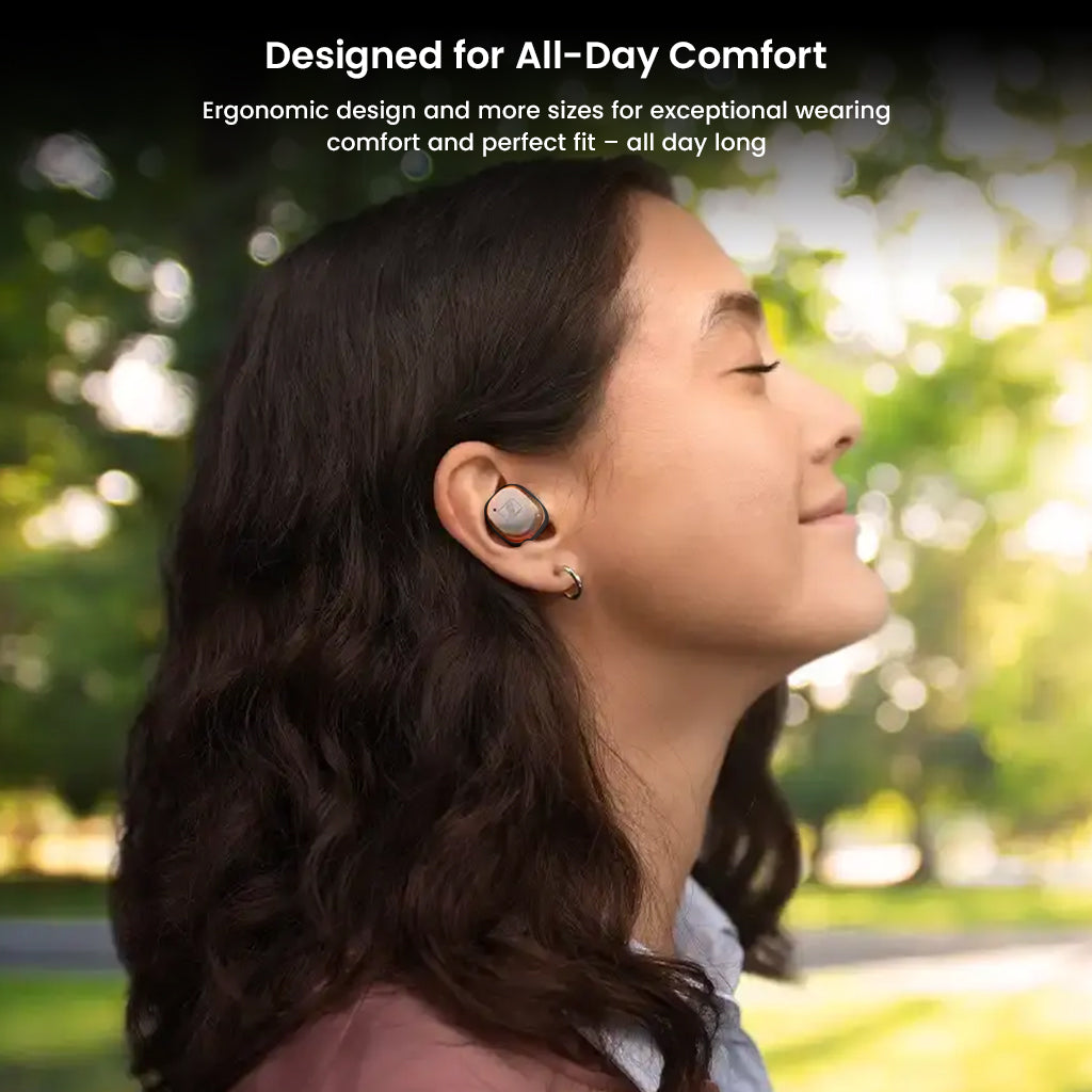 Woman enjoying outdoor comfort with Sennheiser Momentum True Wireless 4 earbuds, designed for ergonomic all-day wear and secure fit.