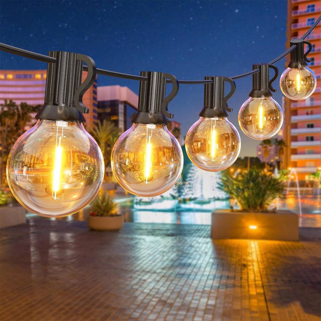 TECPHILE G40 outdoor string lights with waterproof and shatterproof bulbs, illuminating a patio setting. Ideal for home and garden decor.