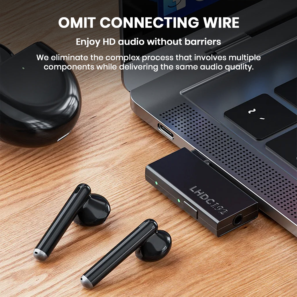 TempoTec LHDC ONE Transmitter connected to laptop, wirelessly streaming audio to earbuds with no cables for seamless listening.