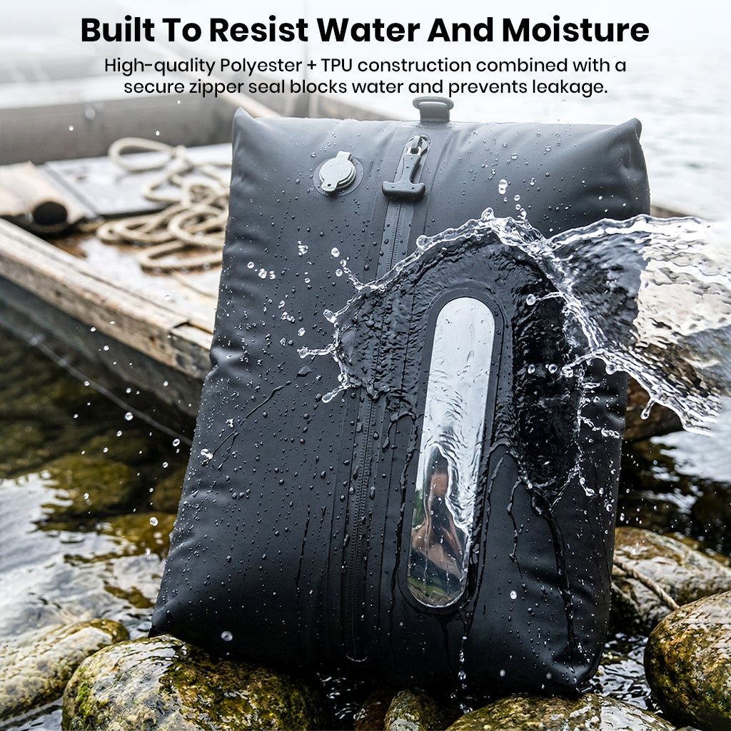 Waterproof vacuum storage bag on bed with clothes and open book