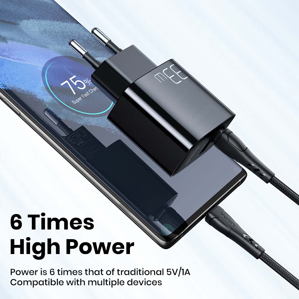 Mcdodo 33W Gan Charger powering smartphone with 6x faster charging speed, compatible with multiple devices for efficient power delivery.