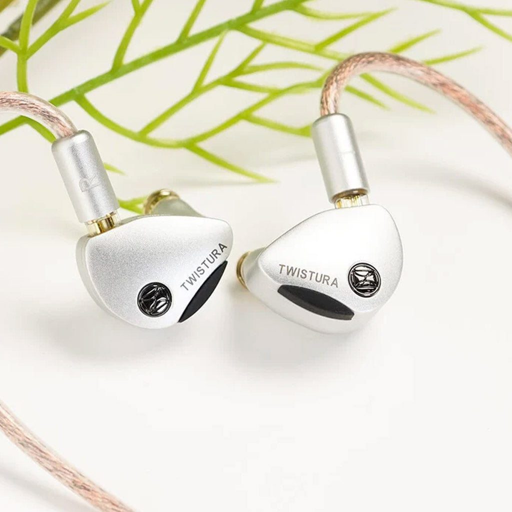 TWISTURA Woodnote IEMs displayed with braided cable and green background, showcasing stylish design and audio performance.