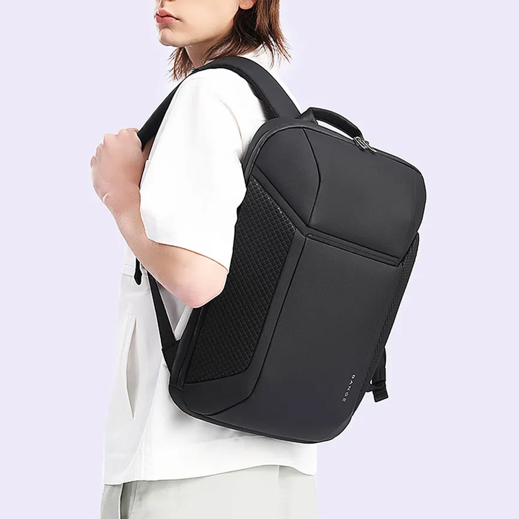 Model wearing BANGE 7710 leather laptop backpack, showcasing its slim profile and comfort fit for daily commuting or travel.