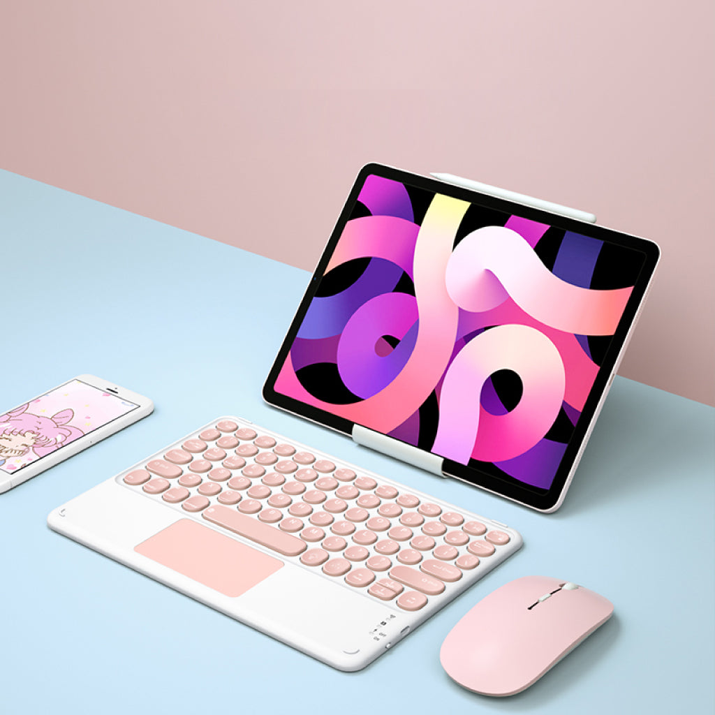 Pink TECPHILE 250D Wireless Keyboard setup with tablet, smartphone, and mouse for a stylish workspace.