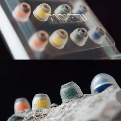 TANGZU Tang Sancai Eartips in transparent case and on stone, highlighting color-coded sizing and durable silicone.