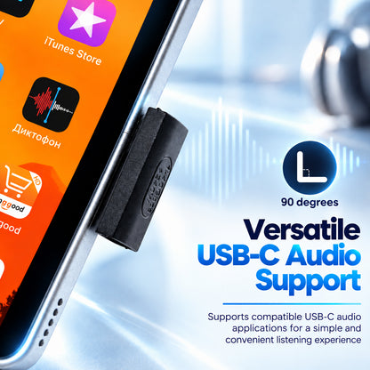 Close-up of a smartphone displaying the iTunes Store app icon with vibrant orange background, emphasizing digital media access.
