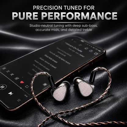 Close-up of in-ear monitors with braided copper cables on a black surface, highlighting premium audio components and sleek design