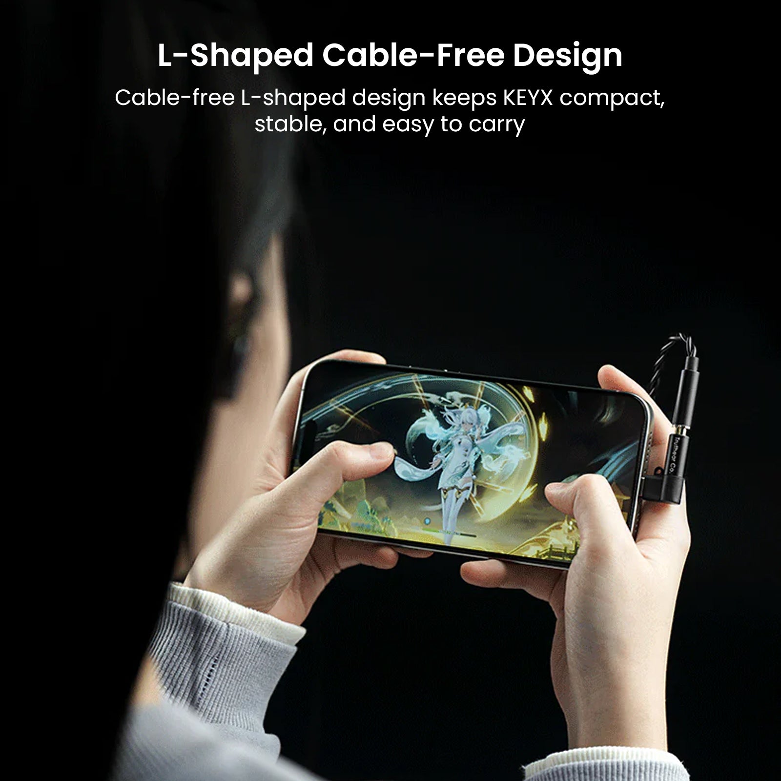 Hands holding a smartphone connected to the compact, L-shaped TRUTHEAR KeyX USB DAC/AMP for high-resolution audio, with gaming visuals on screen