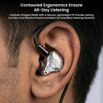 GENESIS G318s IEMs worn in ear, showing contoured ergonomic design for secure fit, passive isolation, and all-day listening comfort.