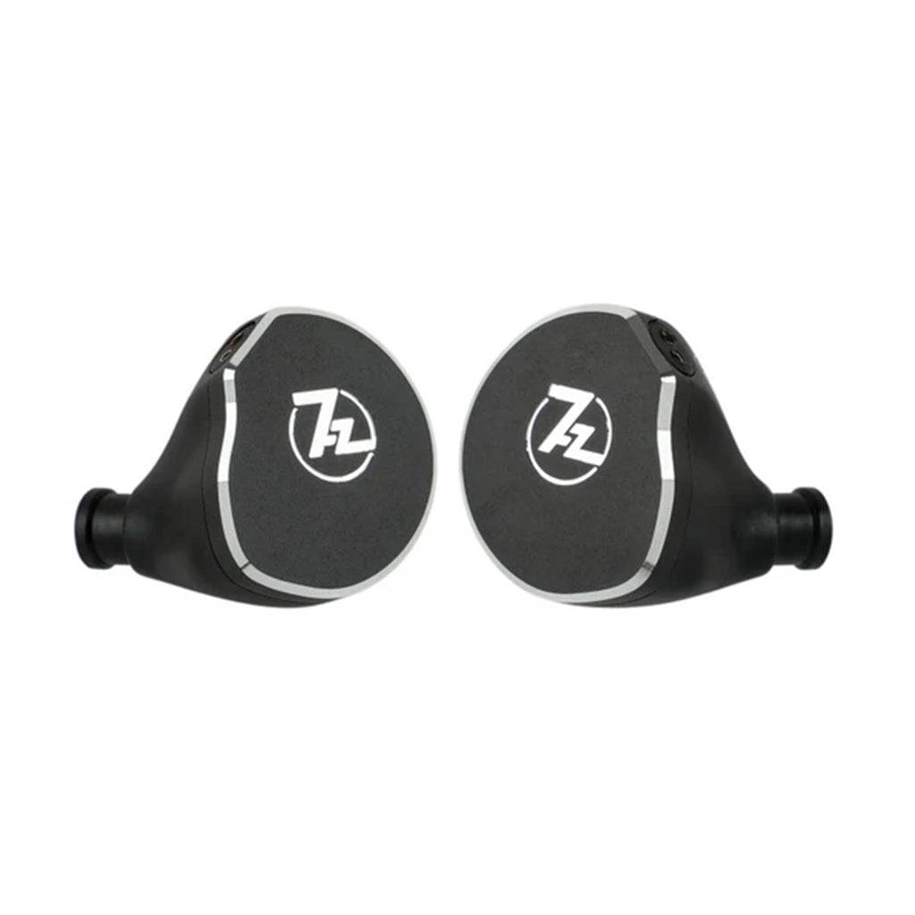 Close-up of 7HZ x Crinacle Diablo planar magnetic IEMs showcasing sleek black aluminum faceplates with 7HZ logo.