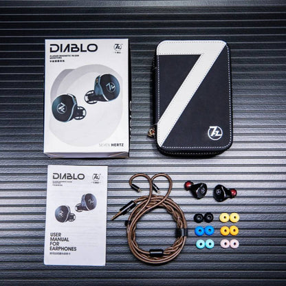 Full 7HZ x Crinacle Diablo IEM package including earphones, cable, eartips, case, and user manual arranged on black surface.