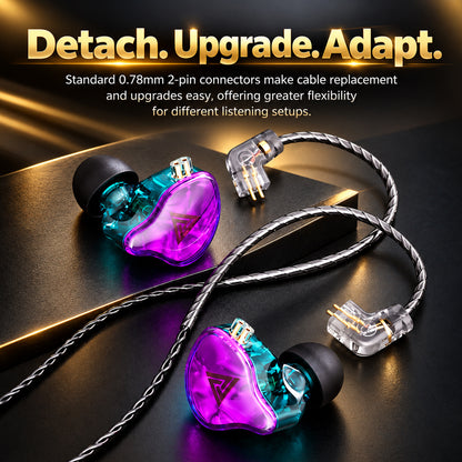 Colorful transparent in-ear monitors with black ear tips, silver braided cable, and gold accents, displayed on a dark textured surface.