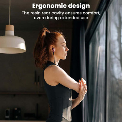 AFUL - PolarNight 15.4mm Dynamic Driver HiFi Earbuds worn by a woman stretching indoors, showcasing ergonomic flat head design for extended comfort.