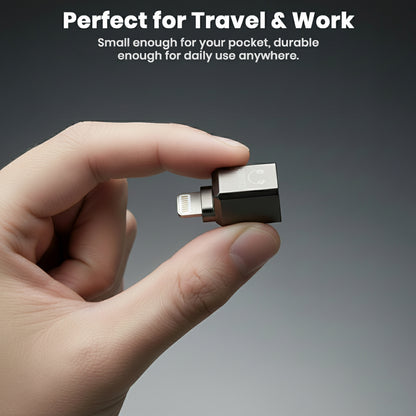 AUDIOCULAR- A19X adapter shown in hand, highlighting its compact size and portability for travel and everyday use.