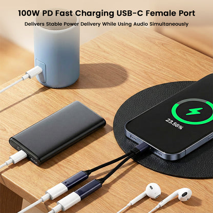 AUDIOCULAR D20 adapter powering a smartphone and speaker while supporting earphones, showcasing 100W PD fast charging and audio use together.