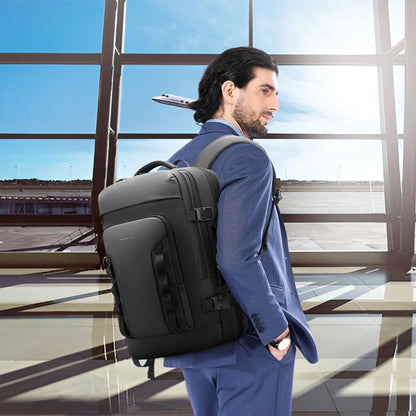 Business traveler wearing BANGE 3055 Laptop Backpack 40L at airport, showcasing professional style and travel-ready design.