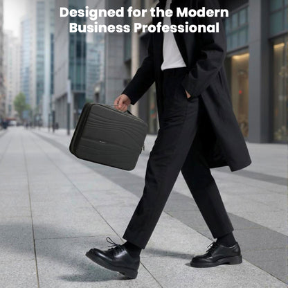 Modern business professional carrying BANGE 14" Waterproof Laptop Messenger Bag, ideal for urban commuting and meetings.