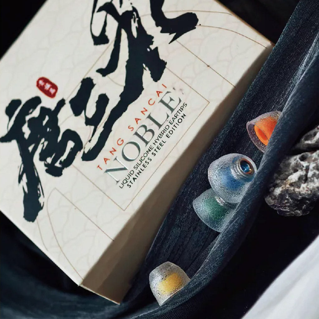 TANGZU Tang Sancai Noble Eartips packaging with visible eartips in various colors, emphasizing premium silicone and design.