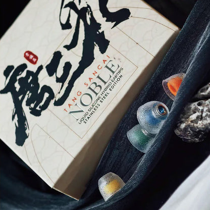 TANGZU Tang Sancai Noble Eartips packaging with visible eartips in various colors, emphasizing premium silicone and design.