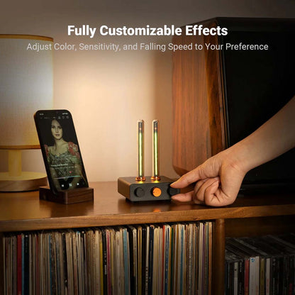 Fosi Audio - AH-01A Music Rhythm Visualizer Light placed on a shelf, demonstrating customizable lighting effects via control knobs for color, sensitivity, and speed.
