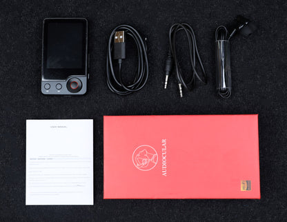 Complete unboxing of AUDIOCULAR M71 Mp3 Player with accessories including USB cable, earphones, aux cable, user manual, and branded packaging.