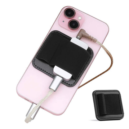 AUDIOCULAR Magnetic DAC Holder in black attached to pink iPhone, demonstrating secure DAC setup with included elastic band.
