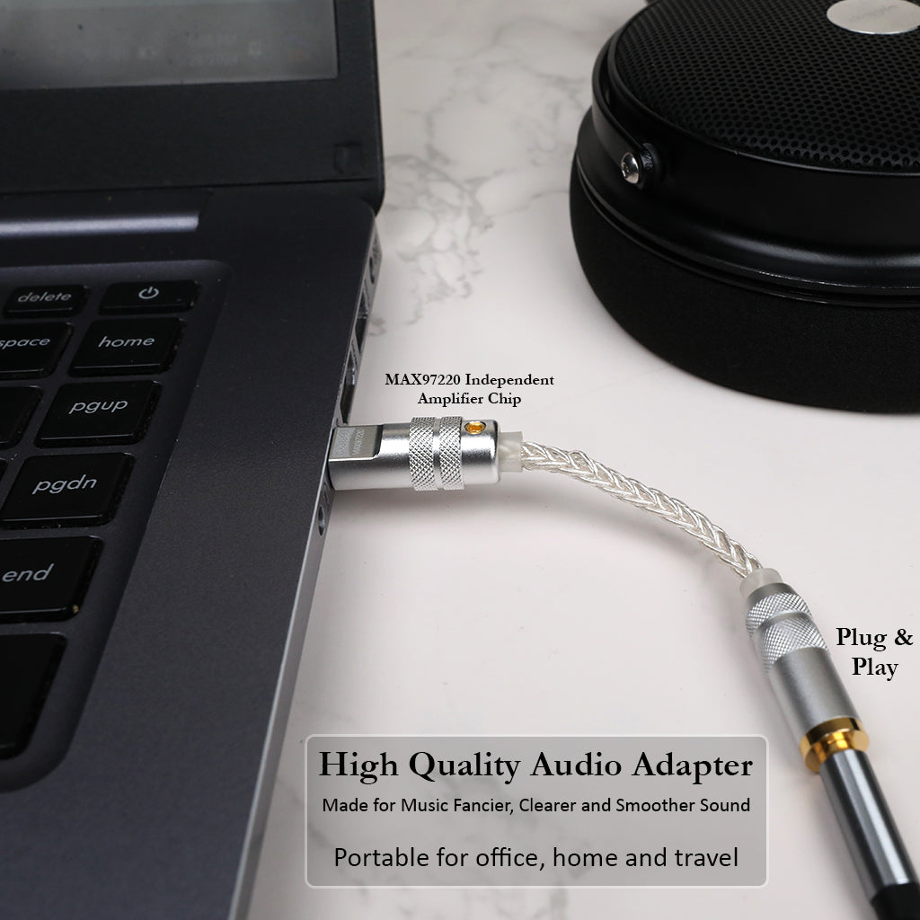 AUDIOCULAR DAC Dongle connected to laptop, featuring MAX97220 amplifier for smooth, clear sound in home or office use.
