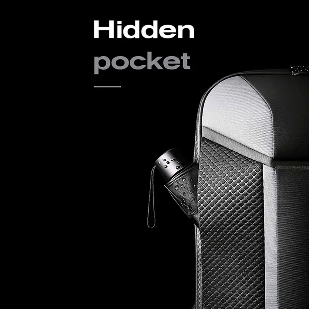 Hidden pocket feature of BANGE 7710 leather laptop bag shown storing a compact umbrella for added convenience.