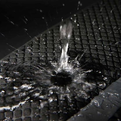 Water-resistant surface of BANGE 7710 leather backpack repelling water, ensuring laptop and gear stay dry in wet conditions.