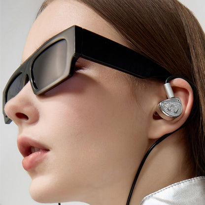 Model wearing EARACOUSTIC STA IEMs, showcasing fashionable design and ergonomic fit for high-end audio on the go.