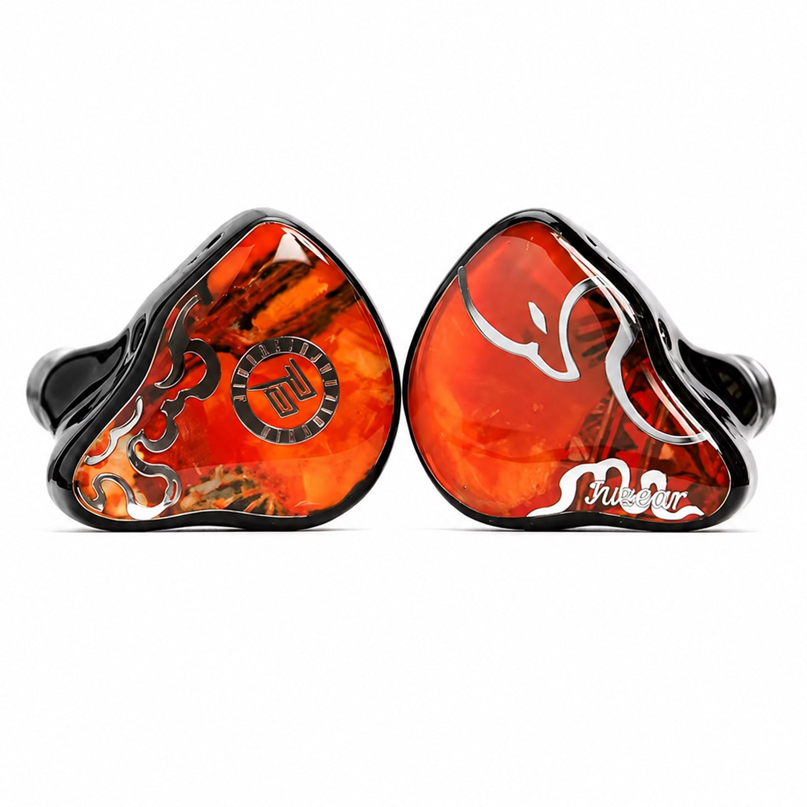 Close-up of vibrant orange and black in-ear monitors with intricate design, glossy finish, and branding, on a white background.