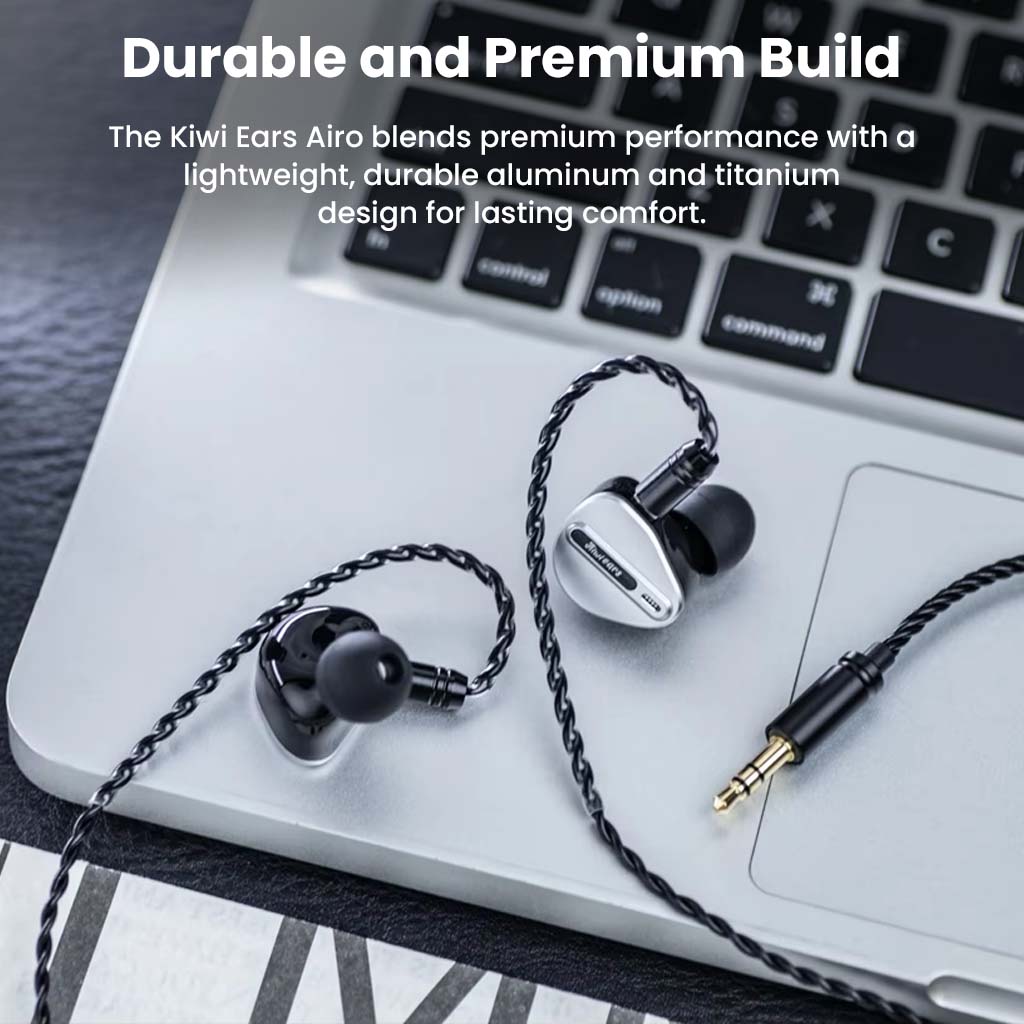 Kiwi Ears Airoso IEM placed on a laptop, showcasing its premium aluminum and titanium build for durability and long-lasting comfort.