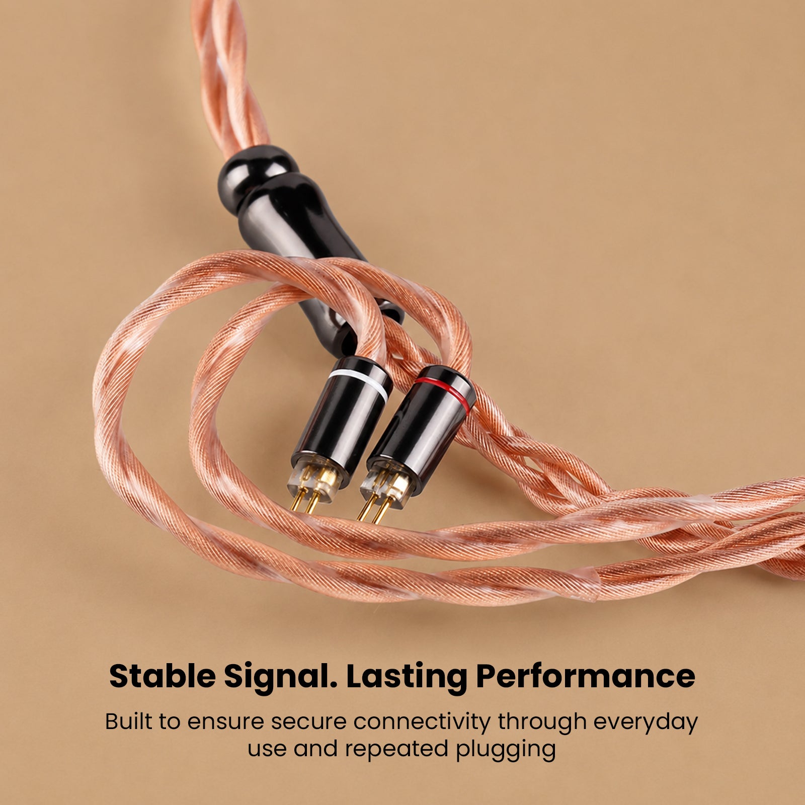 Close-up of copper braided audio cable with black connectors