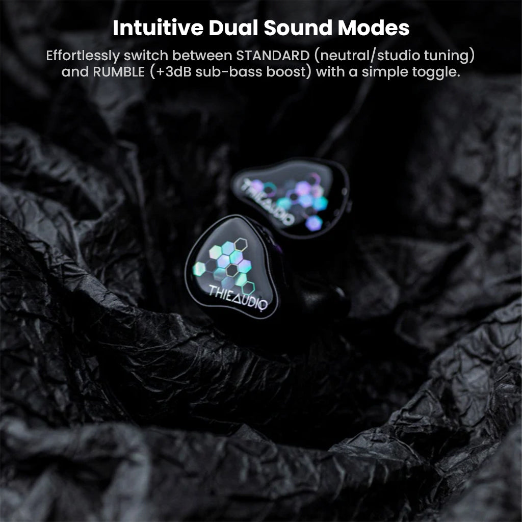 ThieAudio Monarch MKIV IEM on textured surface, featuring dual sound modes with toggle between studio tuning and bass-boosted RUMBLE mode.