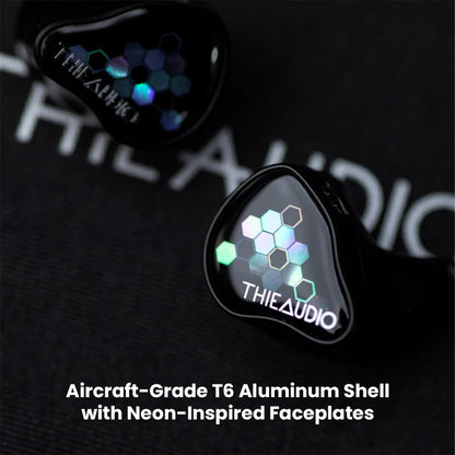 Close-up of ThieAudio Monarch MKIV IEM showing aircraft-grade T6 aluminum shell and hexagonal neon faceplate design for durability and style.